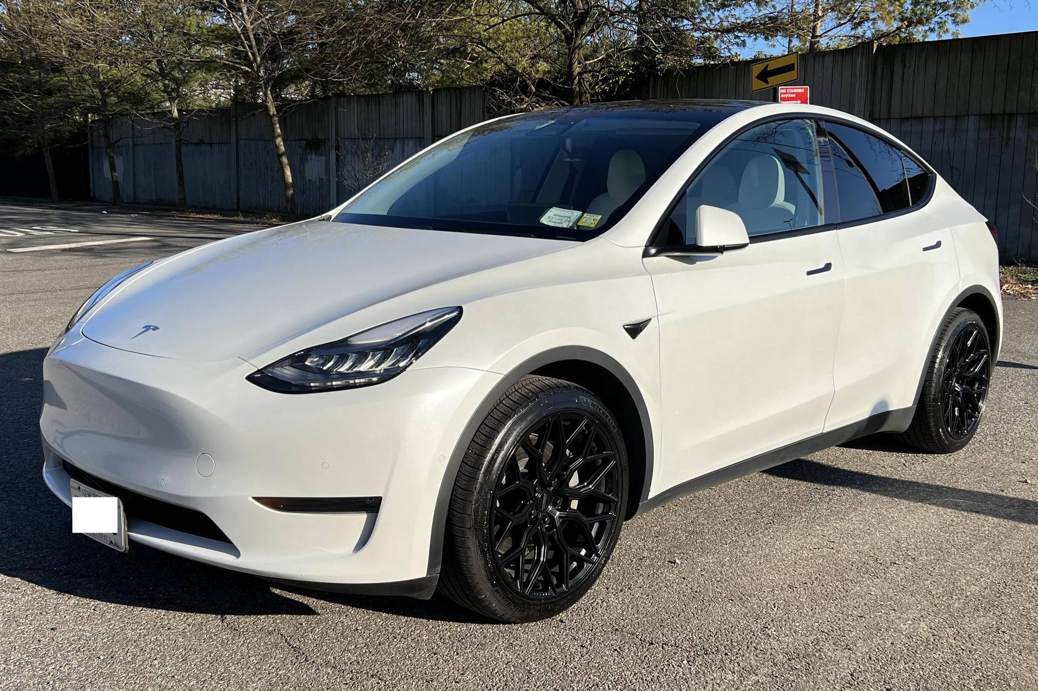 2021 tesla model 3 2024 black with white interior