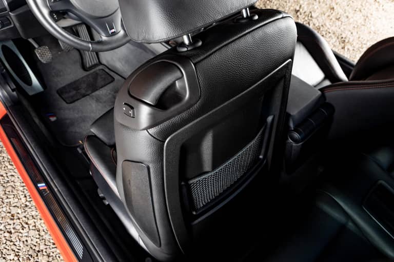 Area behind front seats (if applicable)